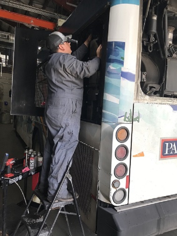 Mechanic working on bus