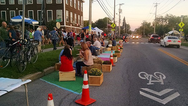 Public seating in Burlington, Vermont using potted plants, wooden crates, traffic cones, and paint (Street Plans)
